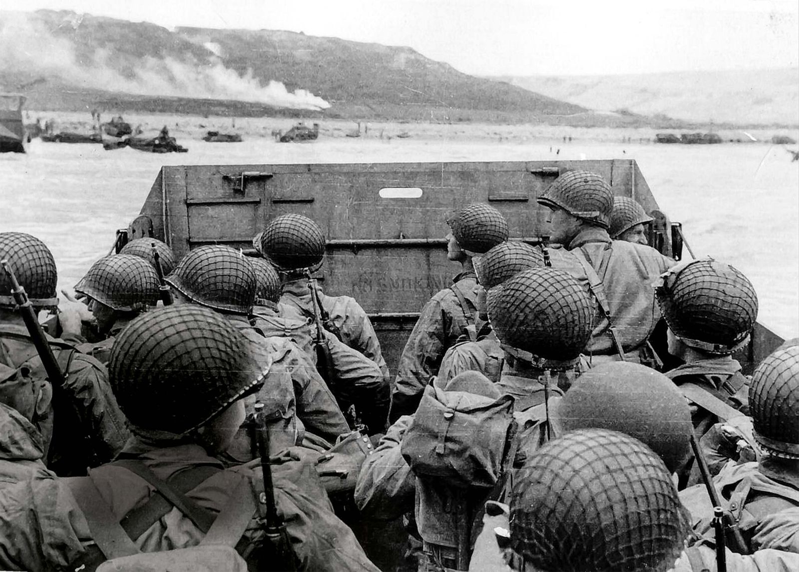 Historic photograph of Allied soldiers approaching Omaha Beach in a landing craft during the D-Day landings on June 6, 1944.