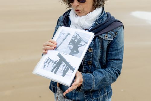 Visitors discovering Omaha Beach from a scenic viewpoint during a guided Normandy tour.