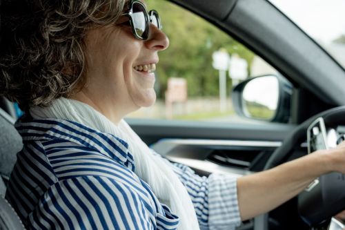 Professional guide driving guests in a comfortable vehicle through Normandy.